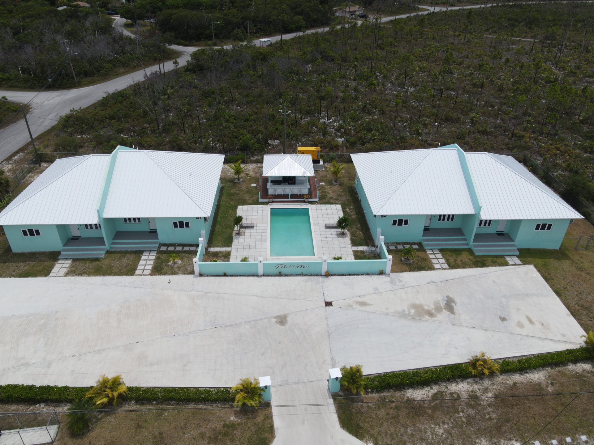 Ellie's Place — turquoise multi-unit development with central pool and cabana